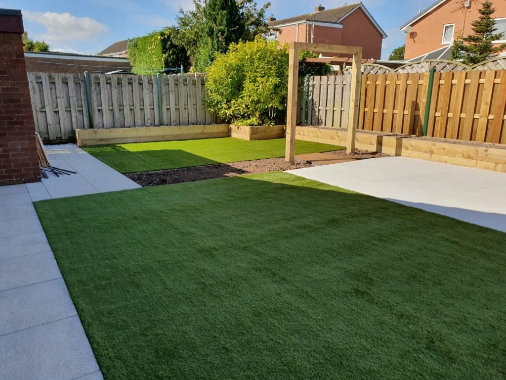 garden with two artificial grass lawns